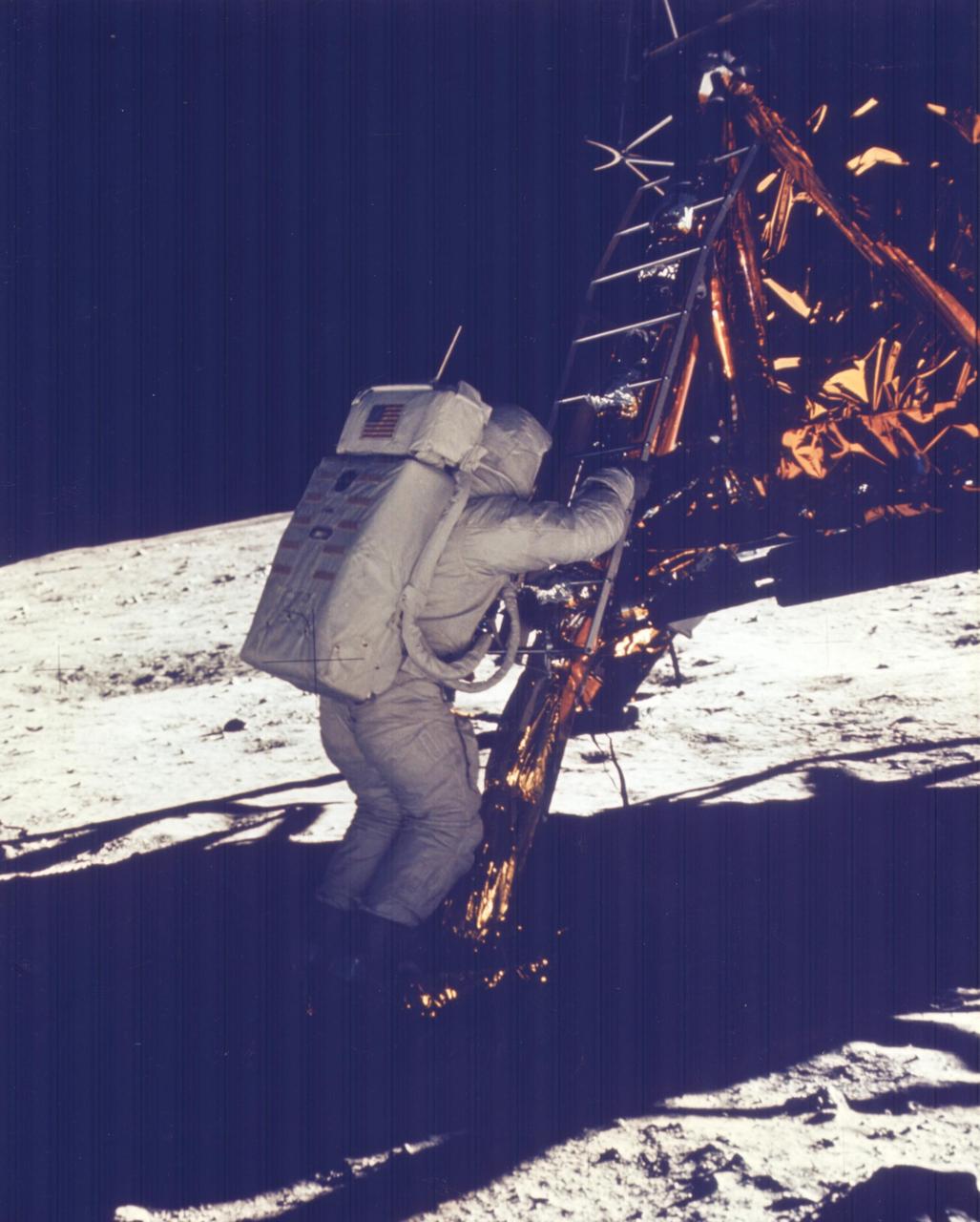 Apollo 11 frame KSC-AS11-40-5869: astronaut at the lunar module ladder